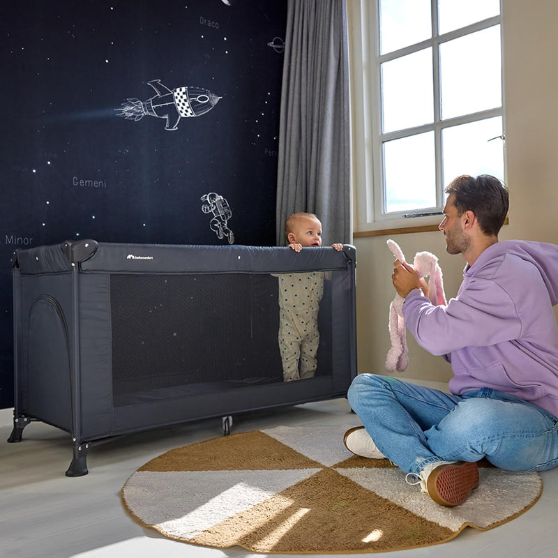 Bebeconfort Sweet Dreams Baby Travel Cot, 0-3 Years (0-15 kg), Travel Cot Lightweight for Babies, Large Padded Mattress, Side Window, Easy Compact Foldable, with Travel Bag, Mineral Graphite